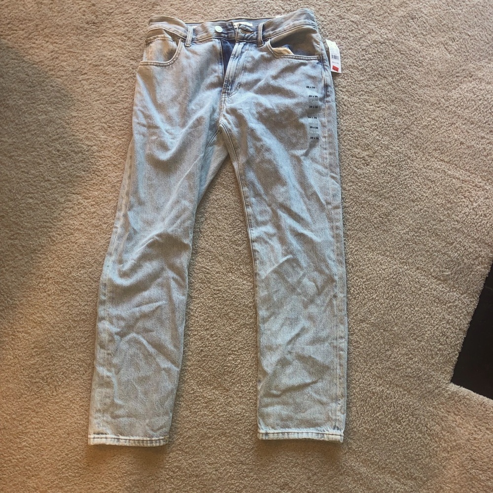 Never worn, light washed denim jeans